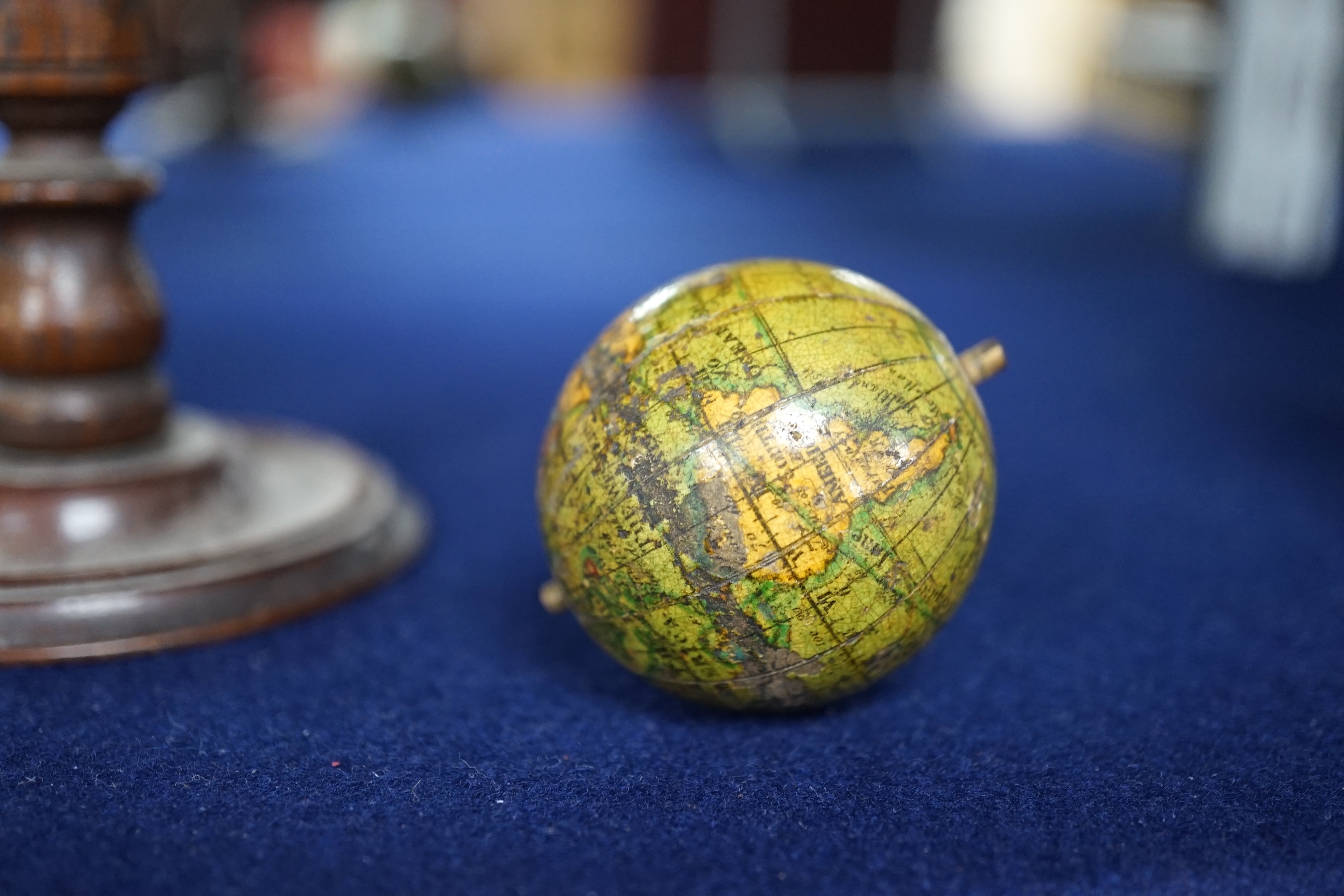 A 19th century 3 inch Stanford celestial globe, the makers panel reads; ‘A new celestial globe showing the principal stars of each Constellation E. Stanford Charing Cross, London’, diameter 7cm, on a turned mahogany stan